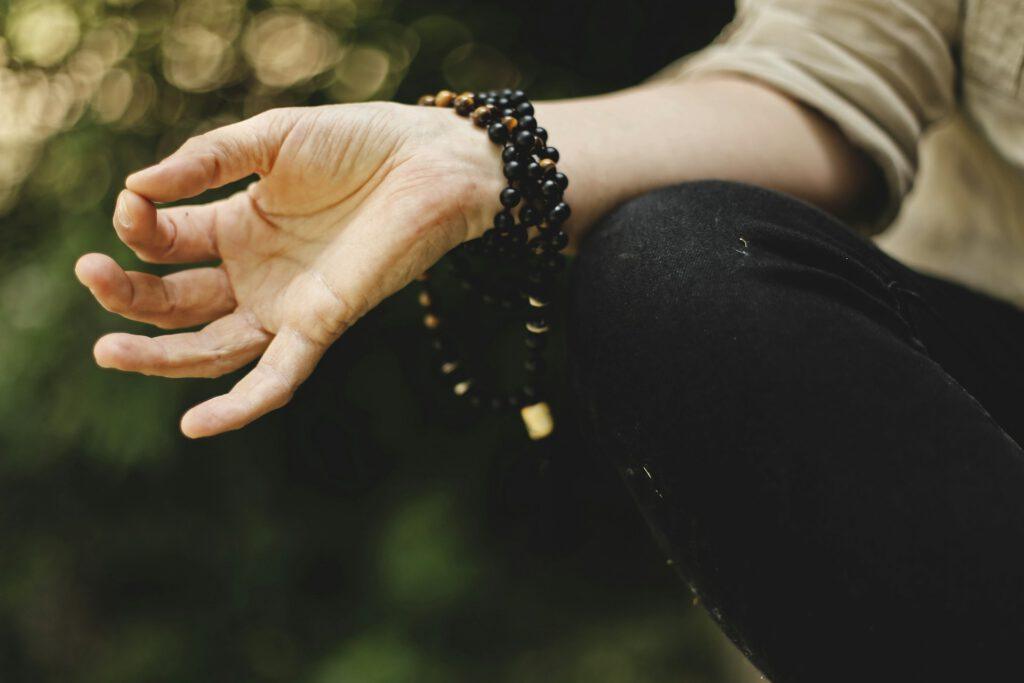 Stretched out hand in a meditative pose.
