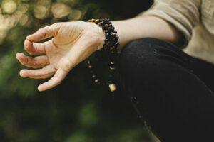Stretched out hand in a meditative pose.